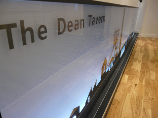 back-lit perspex bar front with graphic. bar refurbishment, Function room, refurbished back-lit bar at Dean Tavern by cb3 design architects Bar shows back lit graphic,