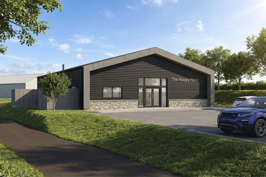 converted barn overclad with timber and stone cladding